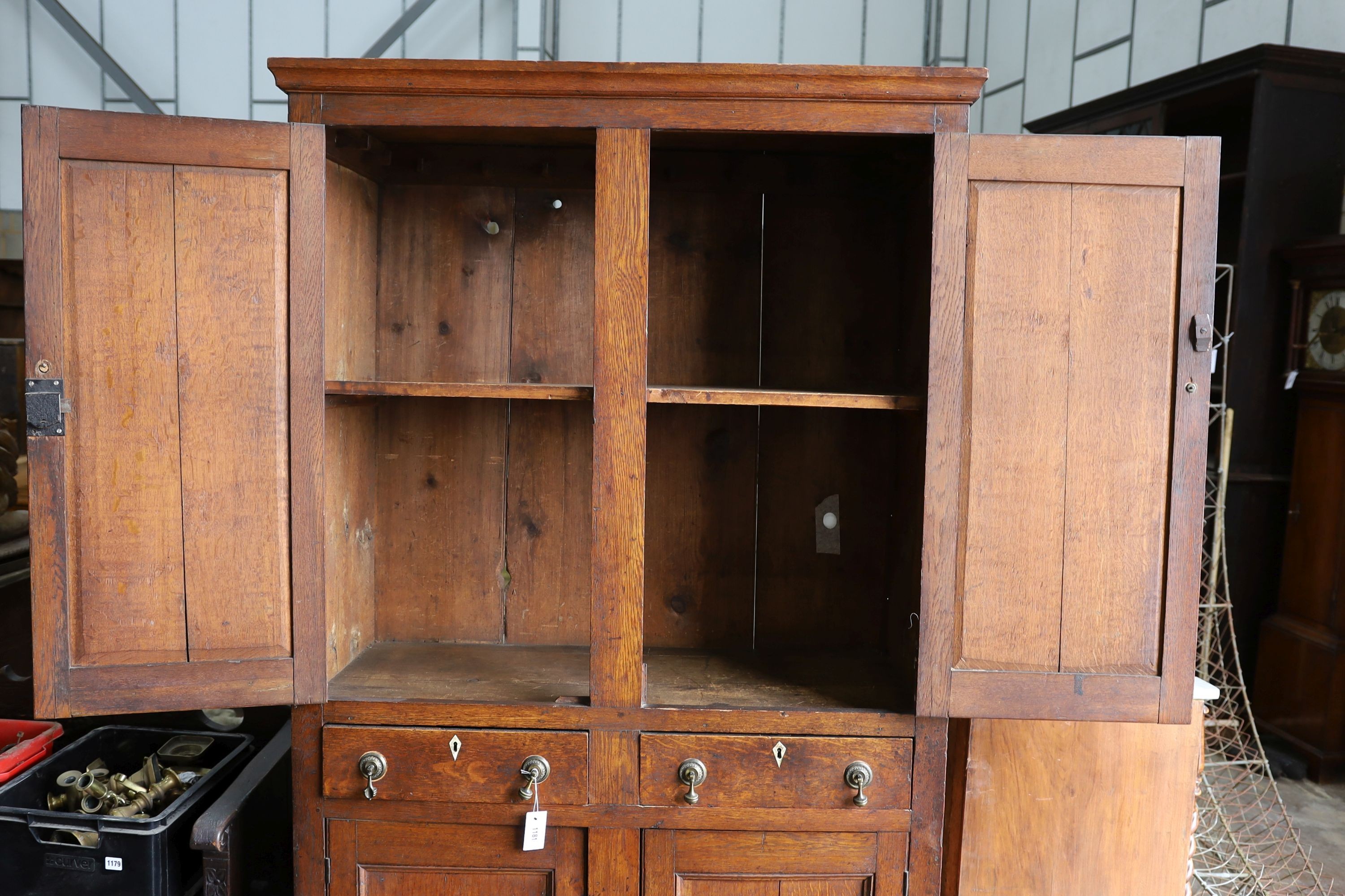 An early 19th century Welsh panelled oak household cabinet. W 116cm, D 52cm, H 200cm